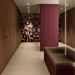 Ulazni prostor kuće s ugradbenim elementima u zagasito crvenoj boji i ogledalima sa skrivenim vratima u drvnom dekoru